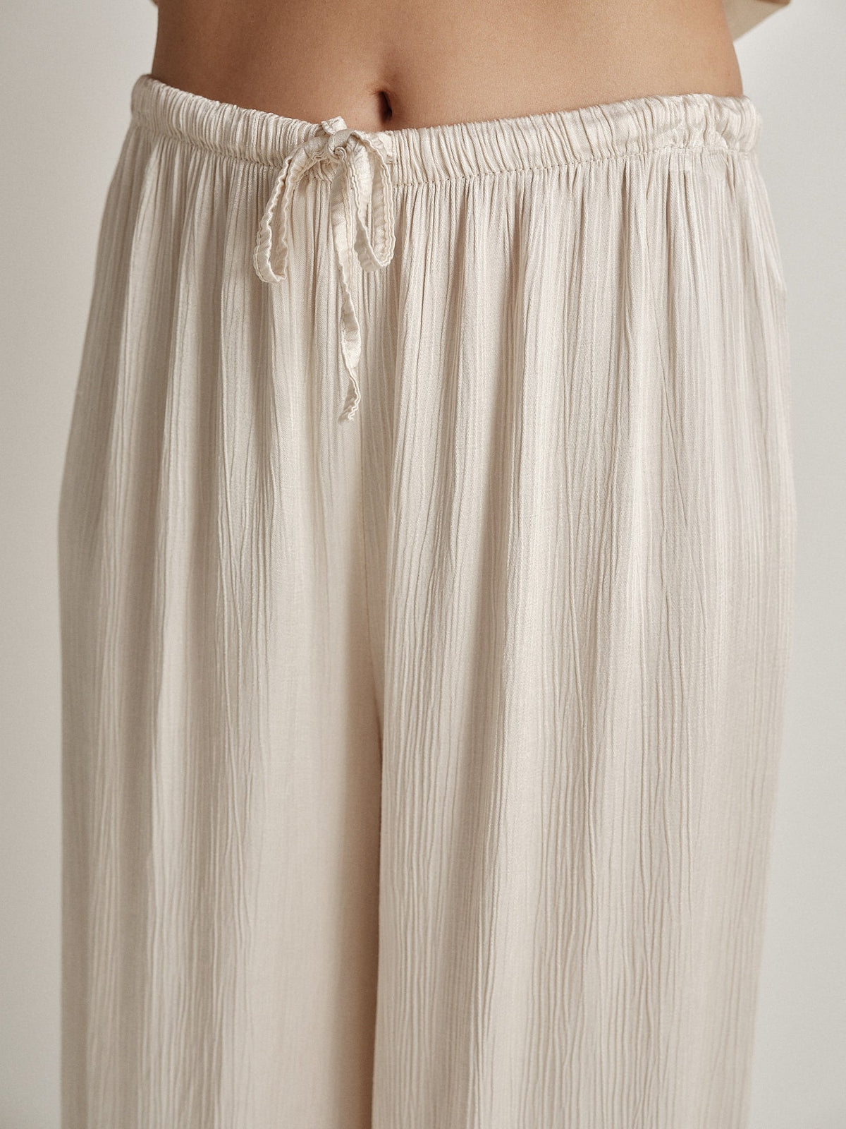 Pantalone wide leg goffrato aeterna